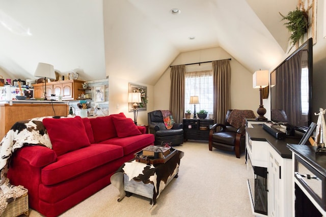 living area with vaulted ceiling and light carpet