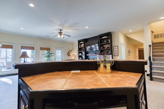 kitchen with recessed lighting, visible vents, carpet flooring, and ornamental molding