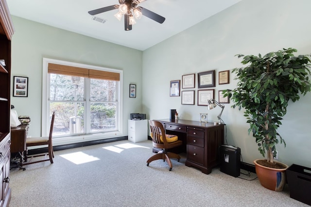 office space with visible vents, a ceiling fan, and carpet floors