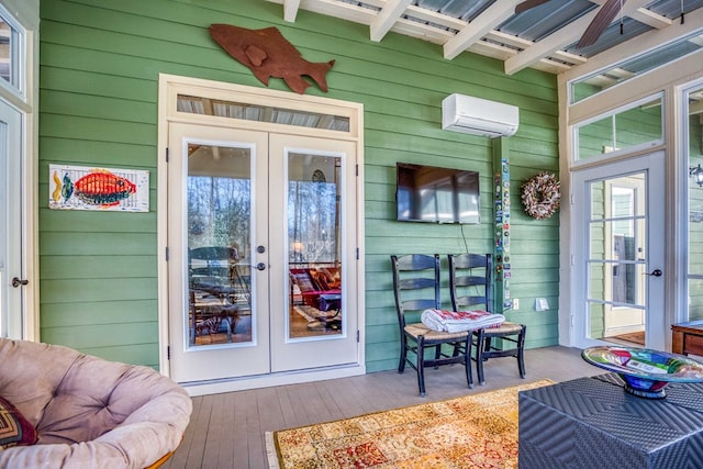 wooden deck featuring french doors and a wall mounted air conditioner