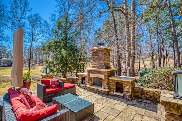 view of patio / terrace featuring an outdoor living space with a fireplace