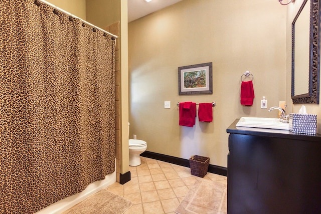 bathroom with vanity, a shower with curtain, baseboards, tile patterned floors, and toilet