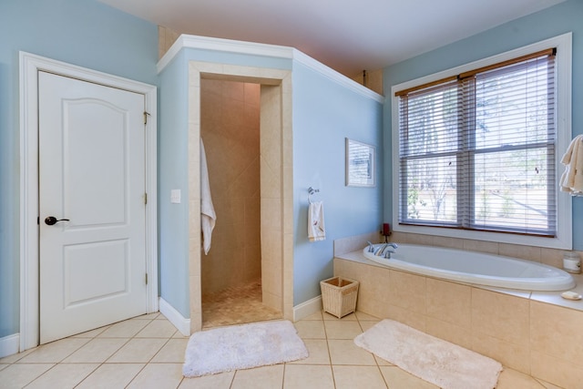 full bathroom featuring tile patterned floors, plenty of natural light, and a garden tub