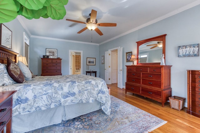 bedroom with a ceiling fan, crown molding, and wood finished floors