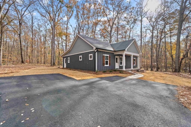 view of property exterior with covered porch