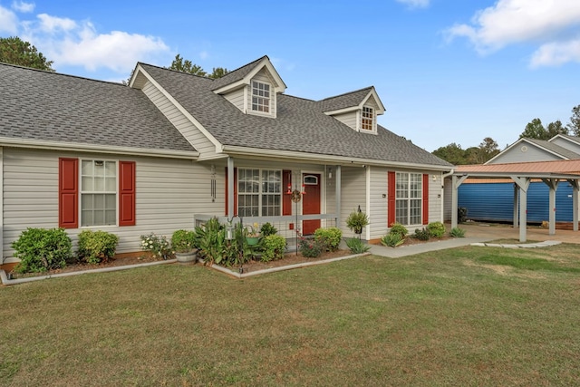 cape cod home with a front yard and a carport