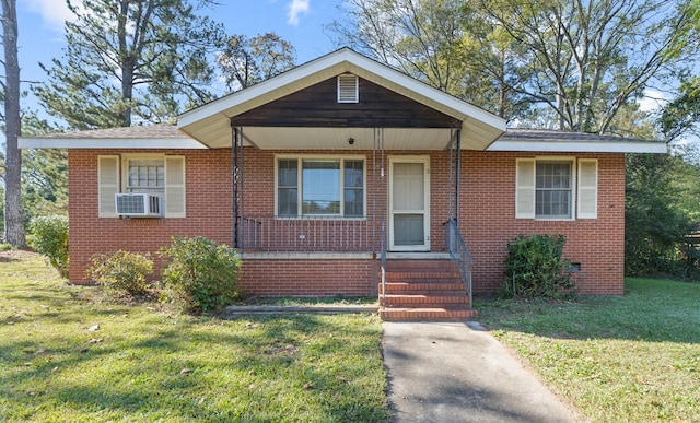 bungalow-style home with a front lawn