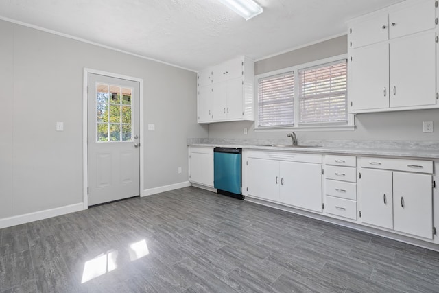 kitchen with dishwasher, white cabinets, a textured ceiling, and sink