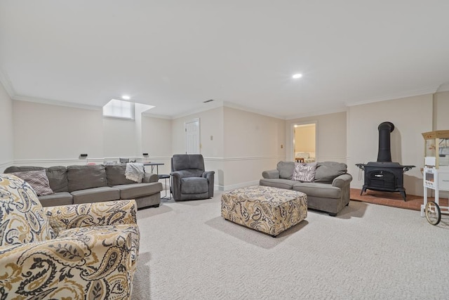 220 Oconnor Dr, Milledgeville, GA 31061 - carpeted living area with a wood stove, ornamental molding, and recessed lighting