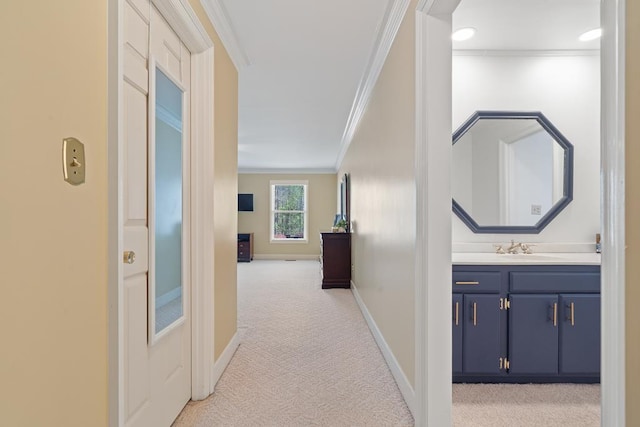 220 Oconnor Dr, Milledgeville, GA 31061 - corridor with crown molding, light carpet, baseboards, and a sink