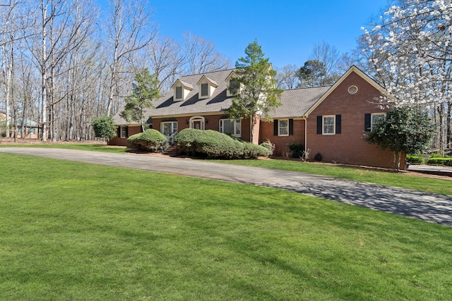 220 Oconnor Dr, Milledgeville, GA 31061 - view of front of home with brick siding, asphalt driveway, and a front yard