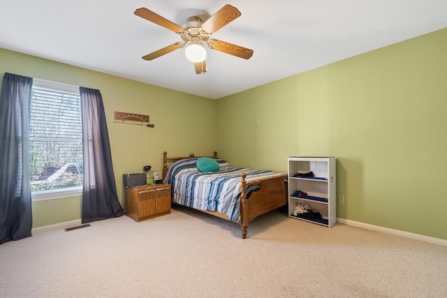220 Oconnor Dr, Milledgeville, GA 31061 - carpeted bedroom featuring baseboards and a ceiling fan