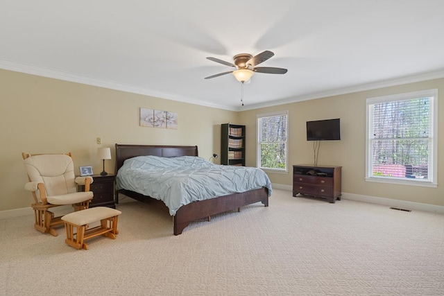 220 Oconnor Dr, Milledgeville, GA 31061 - carpeted bedroom with ornamental molding, multiple windows, baseboards, and a ceiling fan