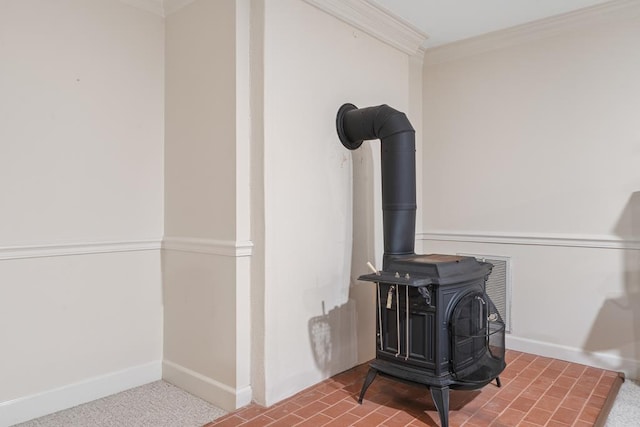 220 Oconnor Dr, Milledgeville, GA 31061 - detailed view of a wood stove, crown molding, and baseboards