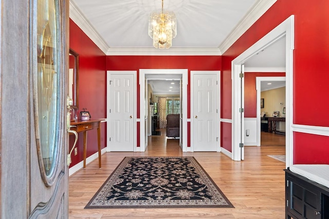 220 Oconnor Dr, Milledgeville, GA 31061 - foyer entrance featuring a chandelier, light wood-type flooring, ornamental molding, and baseboards
