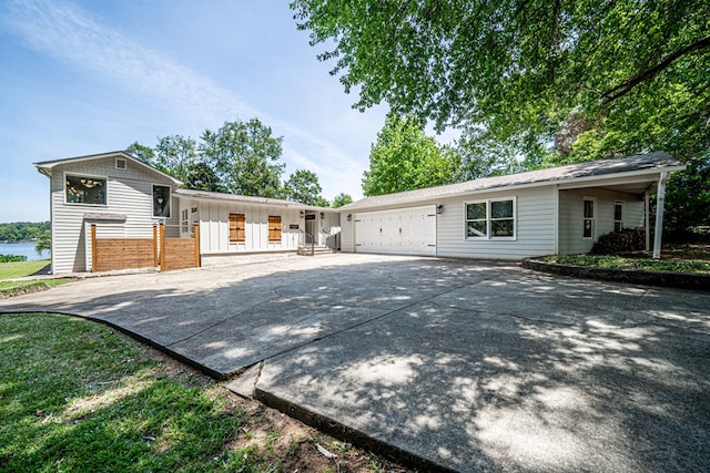 view of front of house featuring concrete driveway and an attached garage