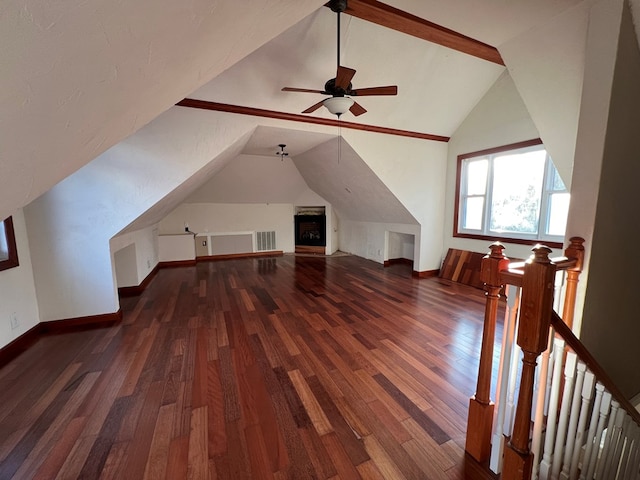 bonus room with vaulted ceiling and dark hardwood / wood-style flooring