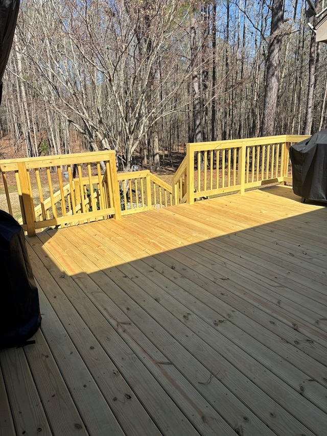 deck featuring a grill