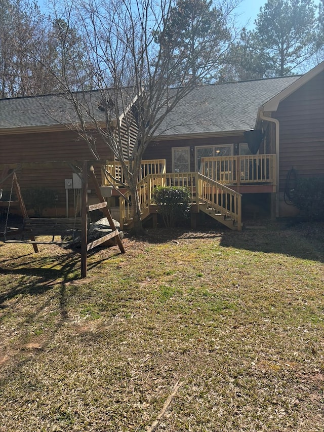 view of yard with a wooden deck