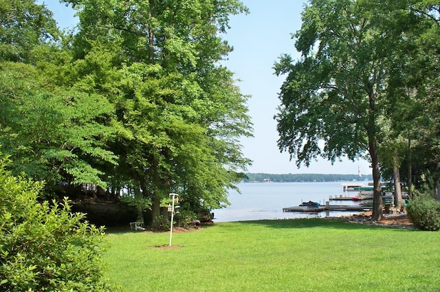 307 E River Bend Dr, Eatonton, GA 31024 - view of grassy yard featuring a boat dock and a water view