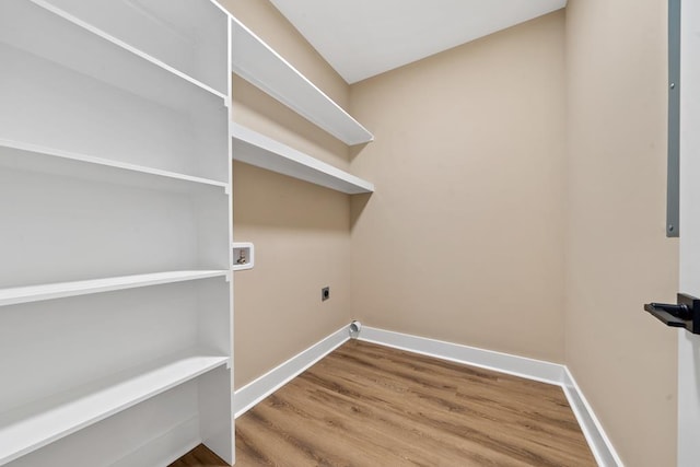 172 Southshore Rd, Eatonton, GA 31024 - laundry room with hookup for an electric dryer, hookup for a washing machine, and wood finished floors