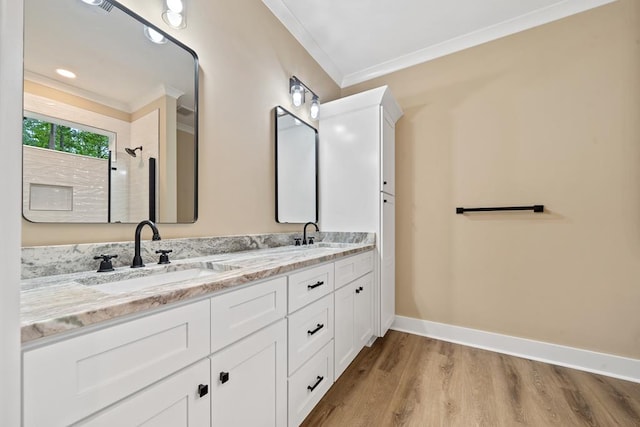 172 Southshore Rd, Eatonton, GA 31024 - bathroom with ornamental molding, double vanity, wood finished floors, and a shower
