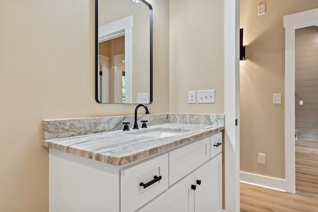 172 Southshore Rd, Eatonton, GA 31024 - bathroom with wood finished floors and vanity
