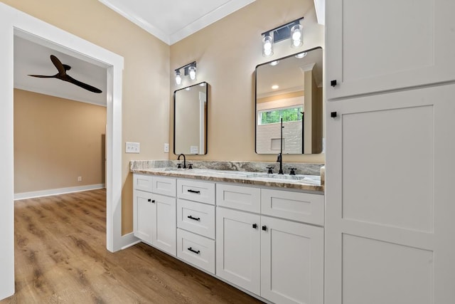 172 Southshore Rd, Eatonton, GA 31024 - full bath featuring double vanity, crown molding, wood finished floors, and ceiling fan