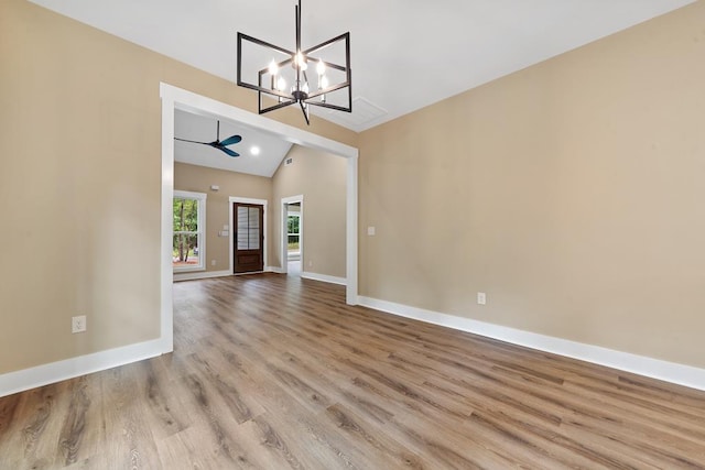 172 Southshore Rd, Eatonton, GA 31024 - unfurnished dining area featuring vaulted ceiling, a chandelier, and wood finished floors