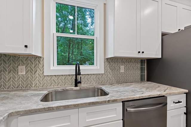 172 Southshore Rd, Eatonton, GA 31024 - kitchen featuring dishwasher, white cabinets, light stone countertops, and tasteful backsplash