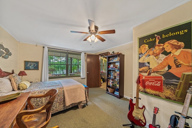 carpeted bedroom with ornamental molding and a ceiling fan