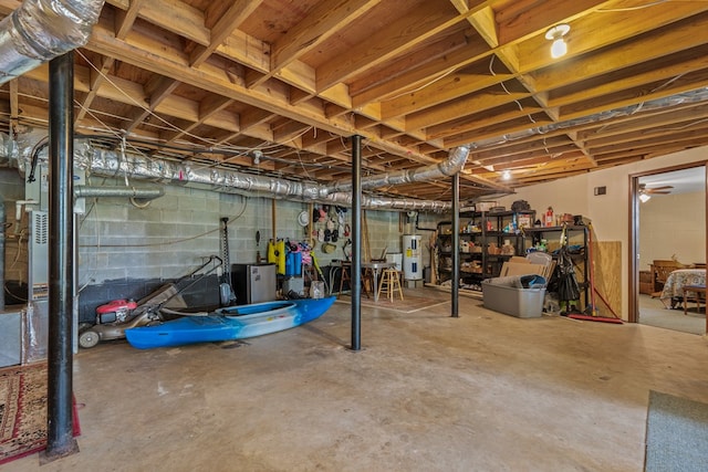 unfinished basement featuring electric water heater