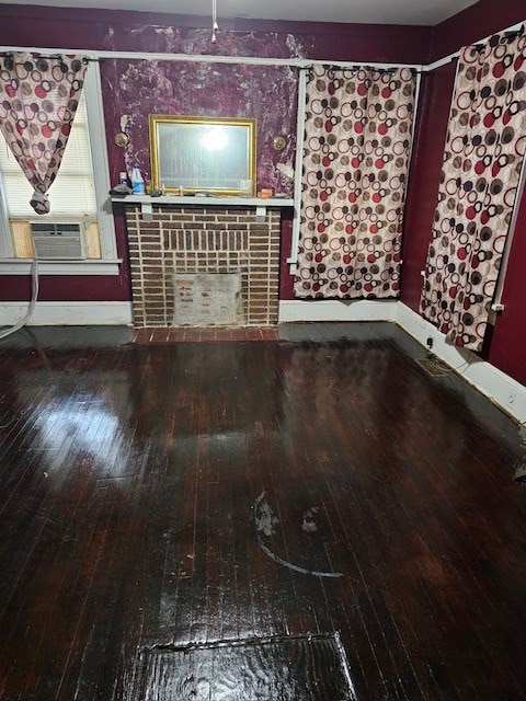 unfurnished living room with hardwood / wood-style flooring and cooling unit