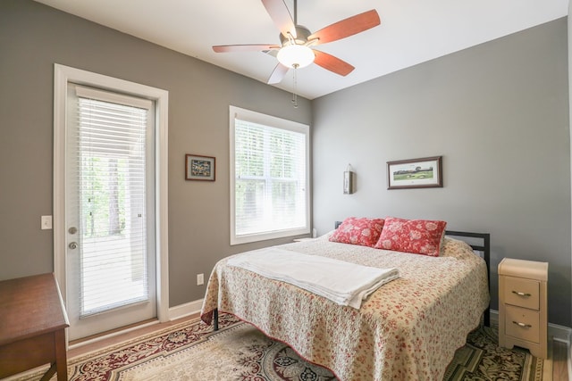 bedroom featuring access to exterior and ceiling fan