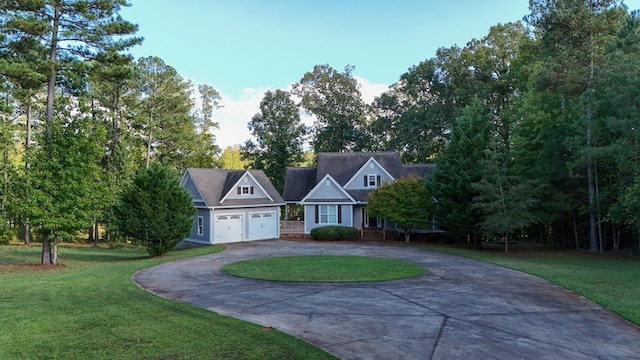 view of front of house featuring a garage and a front yard