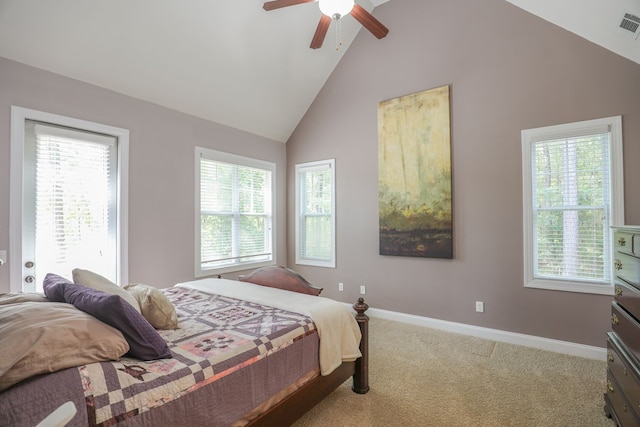 carpeted bedroom with ceiling fan and vaulted ceiling