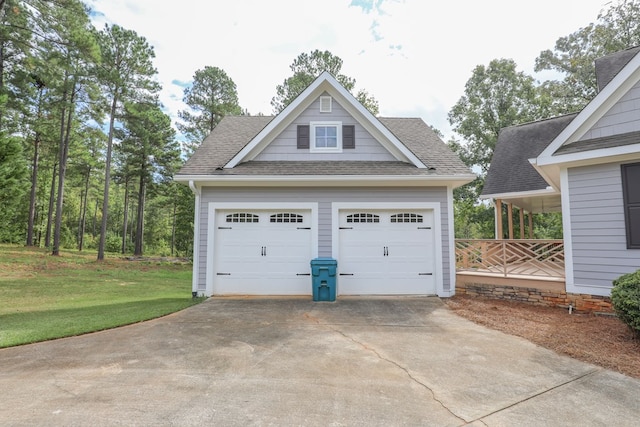 garage featuring a lawn