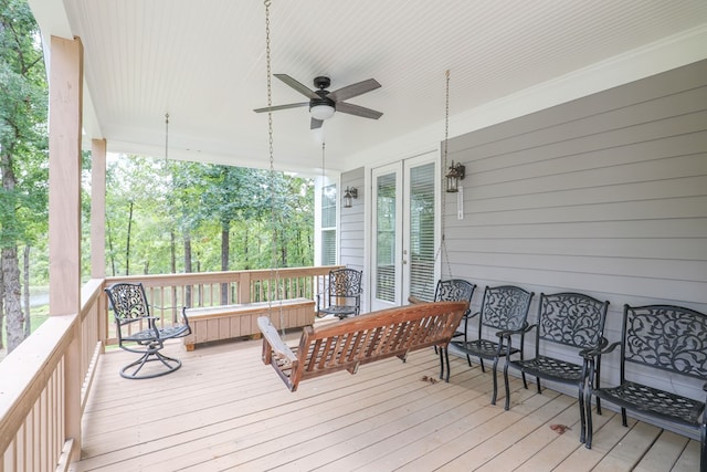 wooden terrace featuring ceiling fan