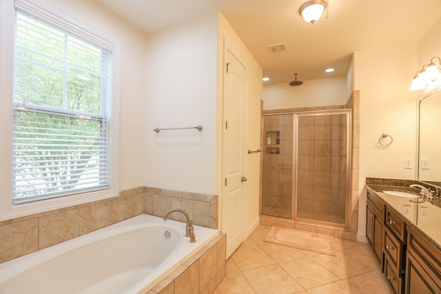 bathroom featuring vanity, tile patterned floors, and separate shower and tub