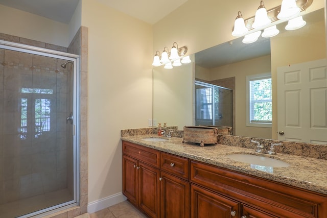 bathroom with tile patterned flooring, vanity, and a shower with shower door