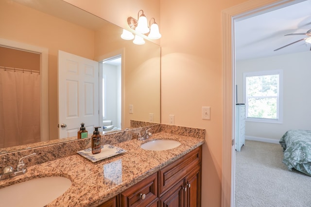 bathroom featuring ceiling fan and vanity