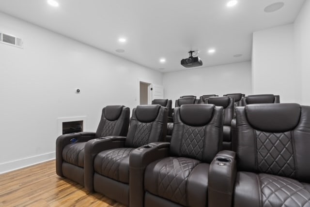 home theater room with light hardwood / wood-style floors