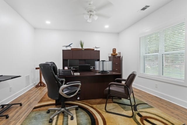 office space featuring ceiling fan and light hardwood / wood-style flooring