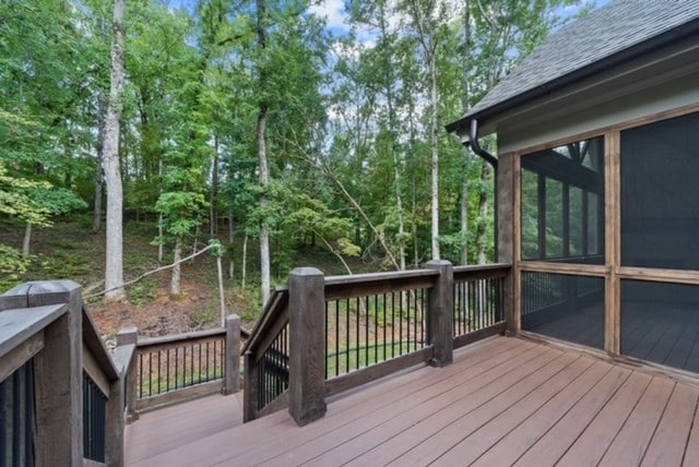 wooden terrace featuring a sunroom