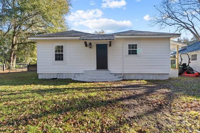 174 Main St, Toomsboro, GA 31090 - rear view of property featuring entry steps and roof with shingles