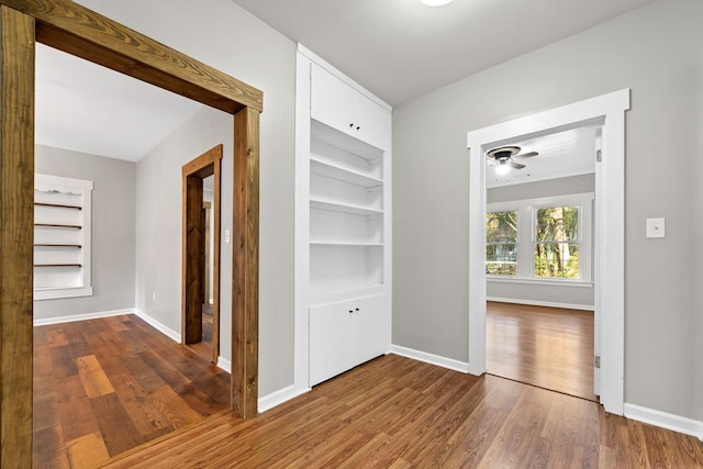 174 Main St, Toomsboro, GA 31090 - hallway featuring wood finished floors, built in features, and baseboards