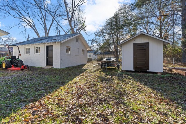 174 Main St, Toomsboro, GA 31090 - view of yard with an outdoor structure