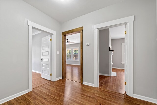 174 Main St, Toomsboro, GA 31090 - unfurnished room featuring wood finished floors, ceiling fan, and baseboards