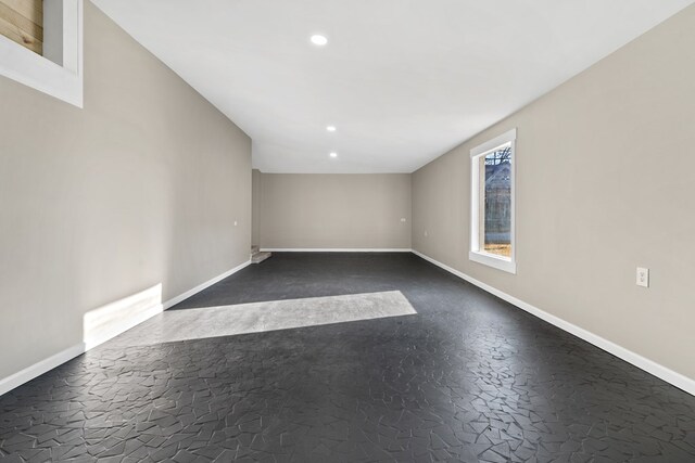 174 Main St, Toomsboro, GA 31090 - spare room featuring baseboards and recessed lighting