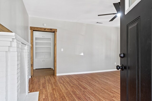 174 Main St, Toomsboro, GA 31090 - unfurnished room featuring wood finished floors, a ceiling fan, and baseboards